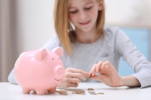 Girl with piggy bank